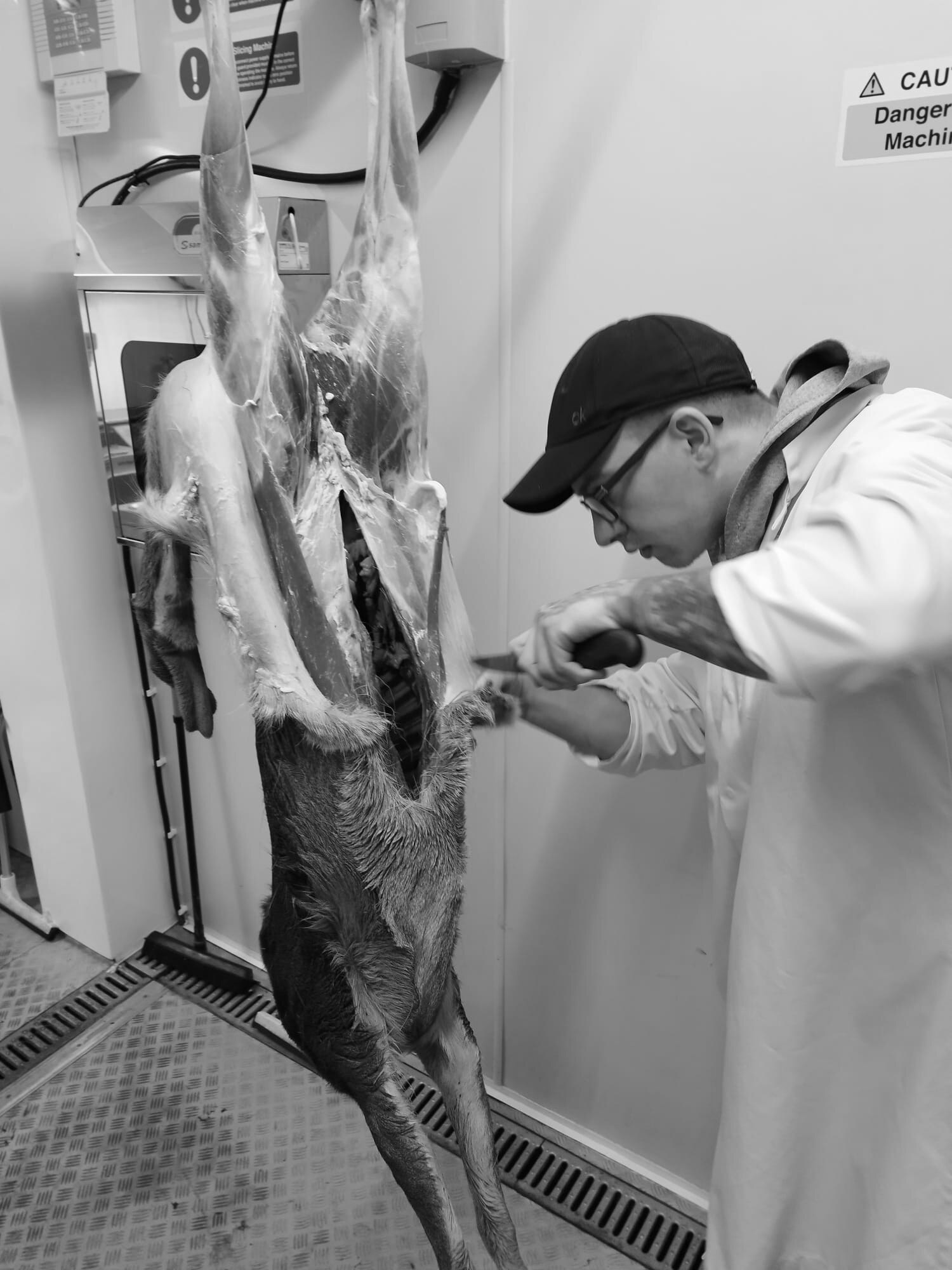 Black-and-white photograph from a Knight's Venison butchery class
